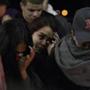 3/6/2016 - Wakefield, MA - Northeast Metropolitan Regional Vocational High School - Melissa Nunez (enyay over second n in Nunez), wiped away tears during a candle light vigil to mark the shooting death of Pablo Villeda, which took place earler that day. Villeda, a Chelsea resident in his late teens, died and seven others were injured after shots rang out at a raucous house party early Sunday morning, March 6, 2016 in Chelsea, MA, igniting a chaotic scene on Washington Avenue. Topic: 07chelsea(3). Story by Astead Herndon /Globe Staff. Photo by Dina Rudick/Globe Staff. 