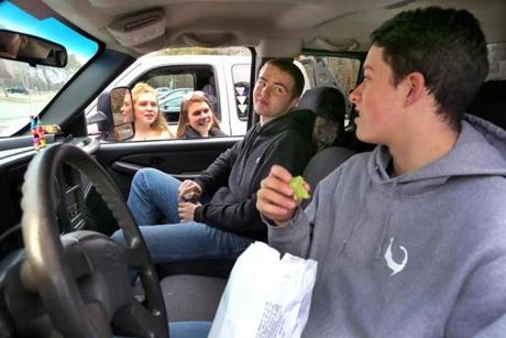Nauset High School student Branden Patterson (right), 17, and a group of his friends show up to school early most mornings, drink coffee in their pickup trucks, and listen to country music while they wait until classes begin.
