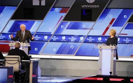 Bernie Sanders and Hillary Clinton spar during the Democratic debate Wednesday night in Miami. 
