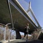March 9th weather was spring-like as a jogger passed under the Zakim Bridge on Wednesday. 