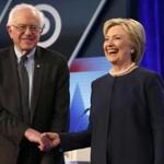 Democratic presidential candidates, Hillary Clinton and Sen. Bernie Sanders, I-Vt, shake hands before the start of the Univision, Washington Post Democratic presidential debate at Miami-Dade College, Wednesday, March 9, 2016, in Miami, Fla. (AP Photo/Wilfredo Lee)