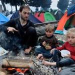 A Syrian father and two of his children were among 14,000 stranded migrants staying in a camp in Idomeni, Greece, near the crossing with Macedonia.