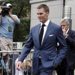 FILE - In this Monday, Aug. 31, 2015, file photo, New England Patriots quarterback Tom Brady leaves federal court, in New York. Brady did suit up for his team's season opener after a judge erased his four-game suspension for 