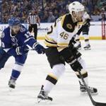 Mar 8, 2016; Tampa, FL, USA; Boston Bruins center David Krejci (46) skates with the puck as Tampa Bay Lightning center Cedric Paquette (13) defends during the first period at Amalie Arena. Mandatory Credit: Kim Klement-USA TODAY Sports