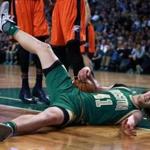 03/16/16: Boston, MA: The Celtics Kelly Olynyk was back in action tonight, here he hits the floor hard after being fouled on a first quarter drive to the basket. The Boston Celtics hosted the Oklahoma City Thunder in a regular season NBA basketball game at the TD Garden. (Globe Staff Photo/Jim Davis) section:sports topic:celtics-thunder