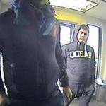 These two men were seen on video attaching a skimmer to an ATM. 