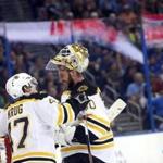 Boston Bruins goalie Jonas Gustavsson (50), of Sweden, speaks with defenseman Torey Krug (47) after blocking a shot on goal during the second period of an NHL hockey game against the Tampa Bay Lightning, Tuesday, March 8, 2016, in Tampa, Fla. (AP Photo/Brian Blanco)