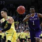 SPOKANE, WA - MARCH 18: Dillon Brooks #24 of the Oregon Ducks passes against Karl Charles #1 of the Holy Cross Crusaders in the first half during the first round of the 2016 NCAA Men's Basketball Tournament at Spokane Veterans Memorial Arena on March 18, 2016 in Spokane, Washington. (Photo by Ezra Shaw/Getty Images)