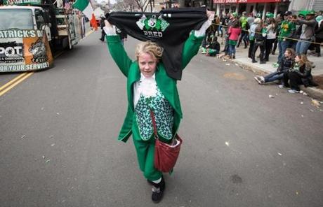 Kathleen Winquist walked along Broadway during the St. Patrick?s Day parade.
