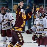 03/12016: Durham, NH: Minnesota's Sophie Skarzynski (center) is all smiles after her team beat BC 3-1. BC players Kaliya Johnson (left) is not so happy. The Boston College women's ice hockey team met Minnesota in the Championship Game of the NCAA Frozen Four hockey tournament at the Whittemore Center on the campus of the University of New Hampshire. (Globe Staff Photo/Jim Davis) section:sports topic:bc-minnesota