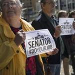 Protesters picketed outside the office of Senator Rob Portman, Republican of Ohio, on Monday.