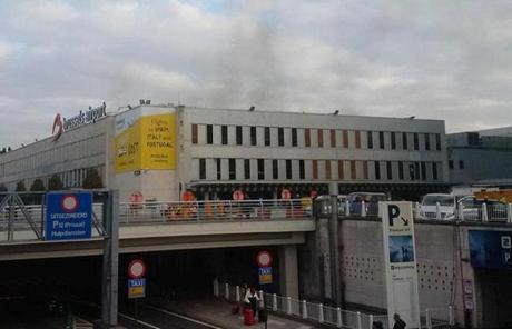 Smoke rose from a building at the Brussels airport.

