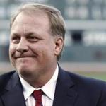 FILE In this Aug. 3, 2012, file photo, former Boston Red Sox pitcher Curt Schilling reacts after being introduced as a new member of the Boston Red Sox Hall of Fame, at Fenway Park in Boston. ESPN says commentator Schilling won't appear on the air for the next month in the wake of his anti-Muslim tweet. ESPN said Thursday, Sept. 3, 2015, that Schilling won't be on telecasts for the rest of the regular season or the American League wild-card game on Oct. 6. The former star pitcher and 