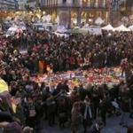 People attended a street memorial service in Brussels. 