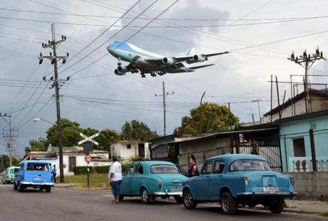 Air Force One carrying US President Barack Obama and his family flies over a neighborhood of Havana as it approaches the runway to land at Havana?s international airport on March 20. 
