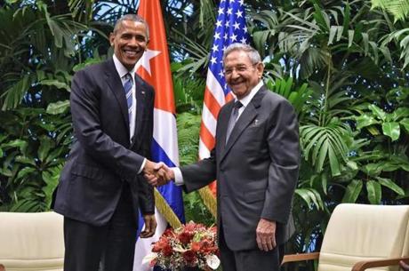 US President Barack Obama (L) and Cuban President Raul Castro shake hands during a meeting at the Revolution Palace in Havana on March 21, 2016. Cuba's Communist President Raul Castro on Monday stood next to Barack Obama and hailed his opposition to a long-standing economic 