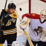Boston- 03/24/2016- Boston Bruins vs Florida Panthers- Bruins Matt Beleskey tries to get control of a flying puck in the 1st period in front of Panthers goalie Roberto Luongo. Boston Globe staff photo by John Tlumacki (sports)