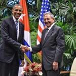 US President Barack Obama (L) and Cuban President Raul Castro shake hands during a meeting at the Revolution Palace in Havana on March 21, 2016. Cuba's Communist President Raul Castro on Monday stood next to Barack Obama and hailed his opposition to a long-standing economic 