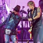 Axl Rose (left) and Duff McKagan of Guns N' Roses performing in 2014. A new tour is set to reunite Rose, McKagan, and guitarist Slash. 