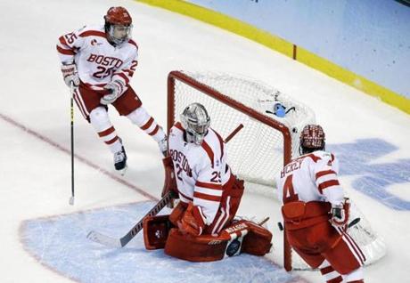 Boston University goalie Matt O'Connor looks back after kicking the puck into his own goal against Providence during the third period of the NCAA men's Frozen Four hockey championship game in 2015.
