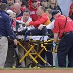 A Fenway Park fan was helped from the stands after being hit with a broken bat in June, 2015. 