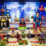 Superhero-themed candies and sweets fill a table at a party at Braza Bar and Grill for Davi, 5, and Lucca, 1, children of Crystiane Rodrigues and Marcelo Guerreira.