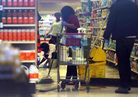 Workers cleaned and sanitized the Roxbury Stop & Shop on Blue Hill Avenue.
