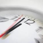 Close up of the hands of clock pointing nearly at 12 o'clock, business concept on deadline or rush hour. Using radial blur effect at 12 o'clock and rest is blurred. ; Shutterstock ID 307637282; PO: mag 3/13