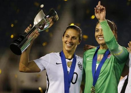 USA women?s national team soccer players Carli Lloyd (left) and Hope Solo celebrates their win of the SheBelieves Cup soccer tournament earlier this month.
