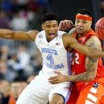 HOUSTON, TEXAS - APRIL 02: Isaiah Hicks #4 of the North Carolina Tar Heels and DaJuan Coleman #32 of the Syracuse Orange battle for the ball in the first half during the NCAA Men's Final Four Semifinal at NRG Stadium on April 2, 2016 in Houston, Texas. (Photo by Ronald Martinez/Getty Images)