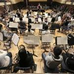 A recent rehearsal of the Fukushima Youth Sinfonietta, an ensemble of young Japanese musicians, at Battin Hall in Lexington. 