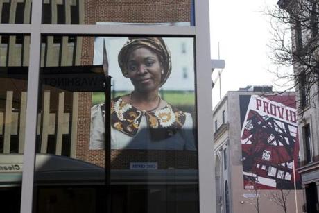 A portrait of Omowunmi Martins is part of Mary Beth Meehan?s installation ?SeenUnseen? in Providence.
