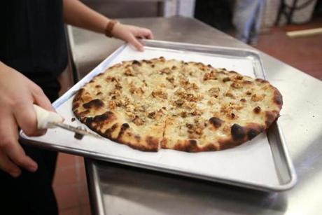 11/15/2015 Chestnut Hill Frank Pepe has opened a new location in Chestnut Hill . A white clam pizza just ot of the oven. Globe/Staff Photographer Jonathan Wiggs
