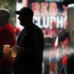 Fans held beers at Fenway Park last September. 
