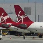 epa05244225 Virgin America's passenger jetliners at the terminal gate in the San Francisco International Airport in San Francisco, California, USA, 04 April 2016. According to US media reports on 04 April 2016, Virgin America has agreed to be bought by the Alaska Air Group for 2.6 billion US dollar. The total value of the transaction, when lease of planes and debt are included, is about 4 billion US dollar. EPA/JOHN G. MABANGLO
