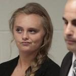Michelle Carter listens to defense attorney Joseph P. Cataldo argues for the involuntary manslaughter charge against her to be dismissed, citing five separate arguments at Juvenile Court in New Bedford, Mass., Monday, Aug. 24, 2015. Michelle Carter, 18, of Plainville, MA is charged with involuntary manslaughter for allegedly pressuring Conrad Roy III, 18, of Fairhaven, Mass. to commit suicide on July 13, 2014. (Peter Pereira/The New Bedford Standard Times via AP)