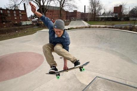 Sawyer Driver-Schroder (top) makes a run through the bowl at the Holyoke Skate Park. 
