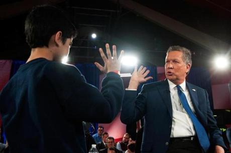Republican presidential candidate John Kasich high-fived a supporter during a campaign stop in Queens on March 30.
