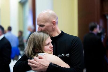 Dave Fortier of Newburyport, who suffered hearing damage in both ears, embraced Elizabeth Bermingham, a fellow bombing survivor.
