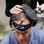 John Elder Robison sat for a simulation of a transcranial magnetic stimulation session at Beth Israel Deaconess Medical Center.