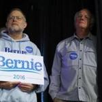 Ben Cohen (R) and Jerry Greenfield, the founders of Ben & Jerry's ice cream, listen to U.S. Democratic presidential candidate Bernie Sanders speak at a campaign event in Exeter, New Hampshire February 5, 2016. REUTERS/Rick Wilking