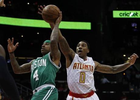 Atlanta, GA - 4/19/2016 - Boston Celtics Isaiah Thomas is guarded by Atlanta Hawks Jeff Teague (R) during the first half at Philips Arena in their second playoff game against the Hawks in Atlanta, Georgia April 19, 2016. Jessica Rinaldi/Globe Staff Topic: Celtics-Hawks Reporter: 
