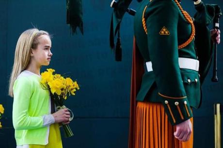 A young girl holds flowers during the Easter Sunday Commemoration Ceremony at the General Post Office March 27 in Dublin.
Getty Images
