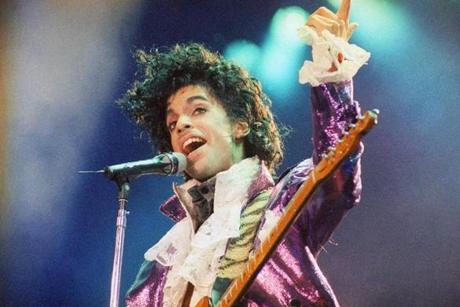 FILE - In this Feb. 18, 1985 file photo, Prince performs at the Forum in Inglewood, Calif. Prince, widely acclaimed as one of the most inventive and influential musicians of his era with hits including 