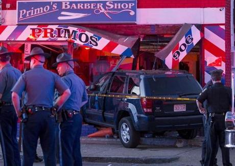 A black SUV smashed into a barbershop in Mattapan on Wednesday. 
