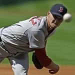 Boston Red Sox's Clay Buchholz delivers a pitch against the Houston Astros in the first inning of a baseball game Saturday, April 23, 2016, in Houston. (AP Photo/Pat Sullivan)