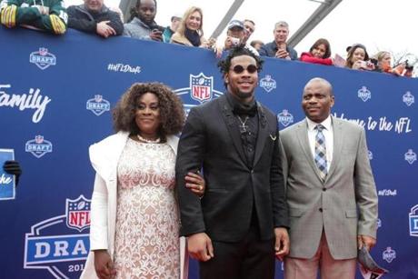 CHICAGO, IL - APRIL 28: Draftee Robert Nkemdiche of Mississippi arrives with mother Beverly and father Sunday at the 2016 NFL Draft on April 28, 2016 in Chicago, Illinois. (Photo by Kena Krutsinger/Getty Images)
