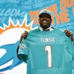 Apr 28, 2016; Chicago, IL, USA; Laremy Tunsil (Mississippi) is selected by the Miami Dolphins as the number thirteen overall pick in the first round of the 2016 NFL Draft at Auditorium Theatre. Mandatory Credit: Kamil Krzaczynski-USA TODAY Sports