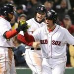 Christian Vazquez celebrated with Jackie Bradley Jr. (left) and Brock Holt after belting a go-ahead two-run homer in the seventh inning.