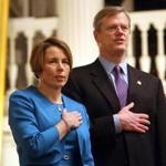 01-21-2015: Boston, MA: Maura Healey (left) and Gov. Charlie Baker during the Pledge of Allegiance during ceremony where Healey was sworn in as Massachusetts Attorney General at Faneuil Hall in Boston, Mass. January 21, 2015. Photo/John Blanding, Boston Globe staff story/David Scharfenberg, Metro ( 22healey ) 